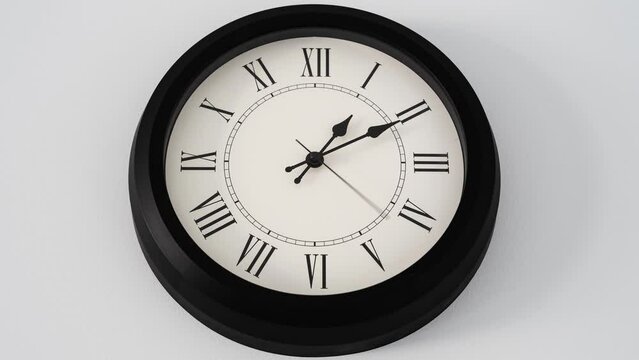 Time is moving backwards timelapse of wall clock