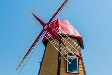 Closeup of replica of Dutch windmill on mountaintop in wilderness park.