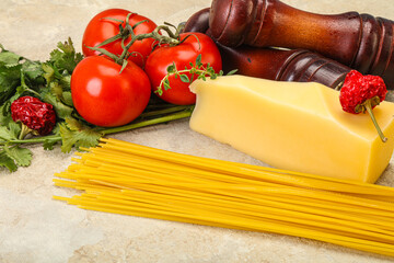 Raw Italian spaghetti heap with cheese