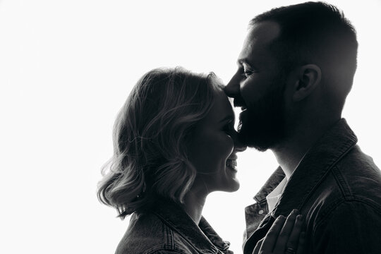 silhouette of a couple, portrait of a couple.  close portrait of a couple in love. portrait man woman on white background.