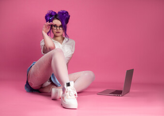 sex and a bright girl in summer clothes poses sexually showing underwear and stockings on the floor...