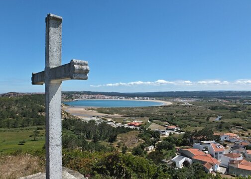 Concha view in Sao Martinho do Porto with stone cross, Centro - Portugal 