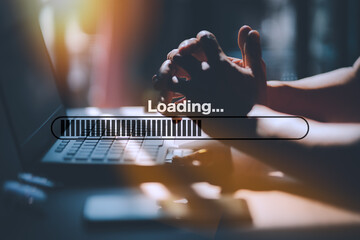 Man using laptop for download and waiting to loading digital business data form website, concept of waiting for load of loading bar. - obrazy, fototapety, plakaty
