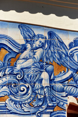 detail of an angel in azulejos tiles on the facade of old railways station in Aveiro, Portugal