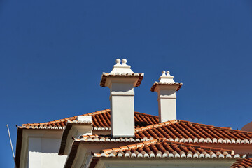 Fototapeta na wymiar tiled roof and chimney on old railways station in Aveiro, Portugal