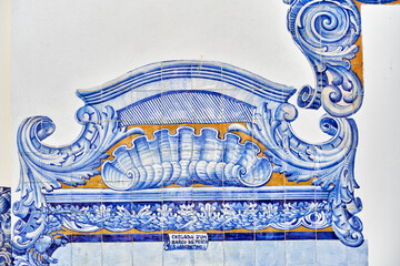 detail of the decoration in azulejos tiles around the windows on the facade of old railways station...