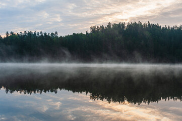 Fototapeta premium Misty lake at sunrise