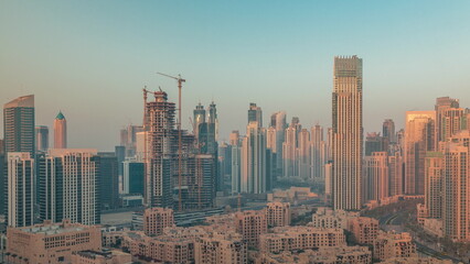Obraz premium Dubai's business bay towers aerial morning timelapse. Rooftop view of some skyscrapers