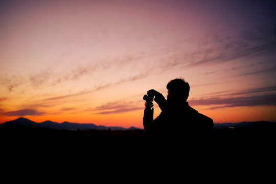 a photographer who takes pictures of the sunset