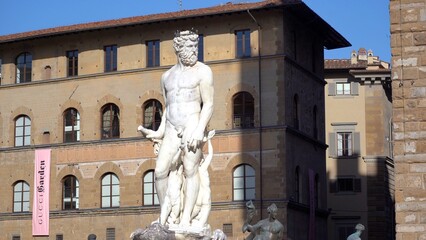 Europe, Italy , Florence 2022 - Neptune ( Nettuno ) Mable fountain   statue in Uffizi Gallery. It is an important art museum located adjacent to Piazza della Signoria in downtown  