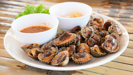 Parboiled cockles or bloody cockles with spicy Thai style dip sauce.