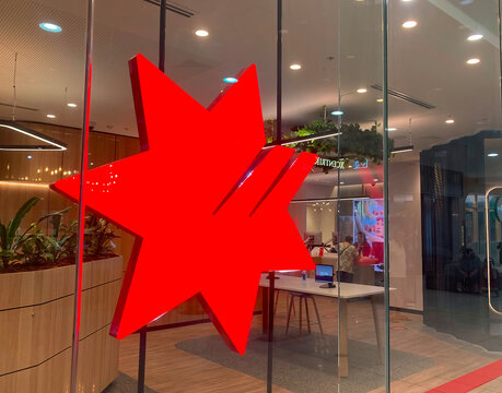 National Australia Bank Branch With Illuminated Signage On The Glass Window