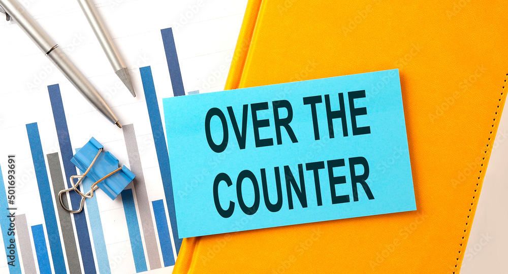 Poster over the counter text on sticker on the yellow notebook with chart and pen