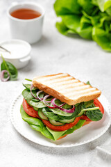 Bread with vegetables. Tasty sandwich with white grilled bread, tomato, salad, onion, cucumber. Breakfast