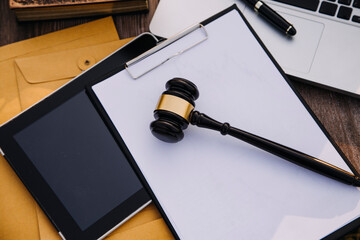 Judge gavel and legal book on wooden table, justice and law concept