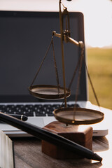 Judge gavel and legal book on wooden table, justice and law concept