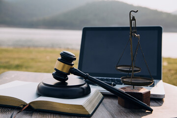 Judge gavel and legal book on wooden table, justice and law concept