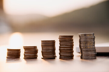 Saving money concept preset by Male hand putting money coin stack growing business