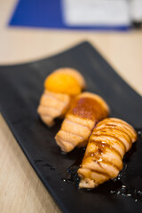 Smoke salmon raw on sushi rice.