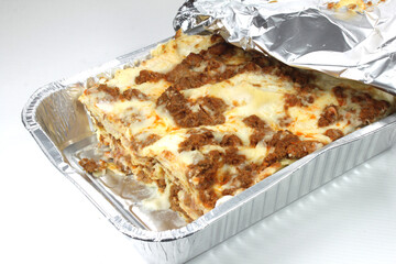 Bolognese lasagna with meat sauce in a pan-
