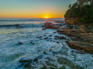 Clear skies aerial sunrise seascape