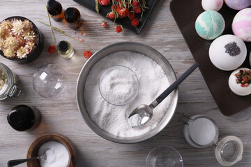 Flat lay composition with bath bomb ingredients on wooden table
