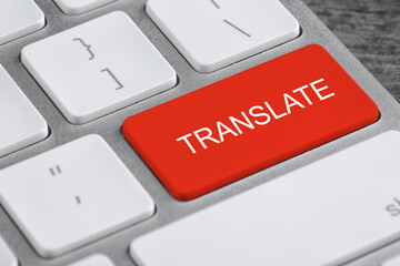 Red button with word TRANSLATE on computer keyboard, closeup view