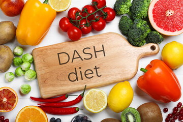 Balanced food for DASH diet to stop hypertension. Different fresh healthy products on white table, flat lay