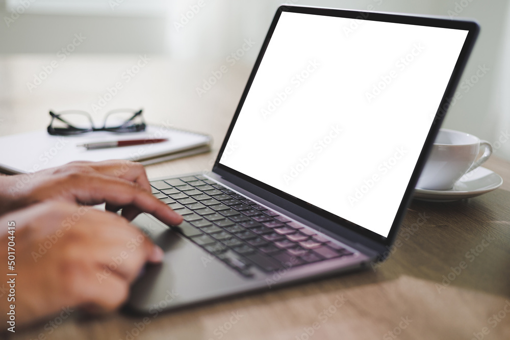 Poster mockup blank screen computer man using laptop on desk in office laptop with blank copy space screen 
