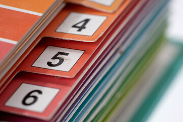 Closeup of the colorful number register of a folder. Shallow depth of field