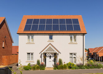 Detached new build home with solar panels on the roof. UK
 - obrazy, fototapety, plakaty