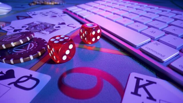 Gaming table with computer keyboard, cards, dice and casino chips. Concept of gambling, online betting in casino. Play poker, blackjack or texas hold'em over internet. Playing a online gambling money.
