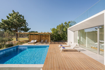 Modern villa with pool and deck with interior - obrazy, fototapety, plakaty