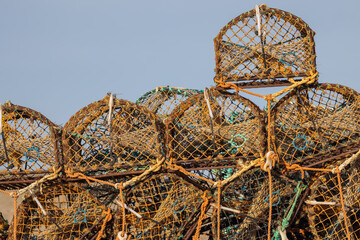 Crab pots or lobster creel stacked. Fishing industry background image
