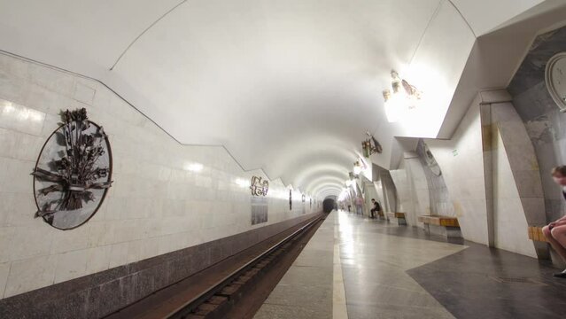 An underground train departing from Pushkinska metro station on Saltivska Line of Kharkiv metro timelapse hyperlapse