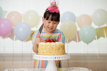 young girl celebrating her 6th birthday at home