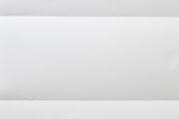 White folded and wrinkled paper texture background