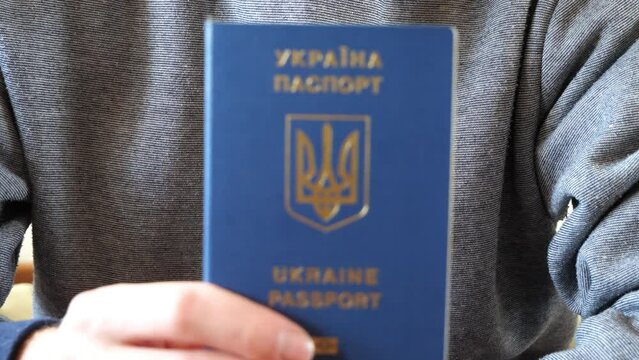 Ukrainian passport in the hand of its owner.
