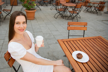 smile woman having breakfast on the summer terrace