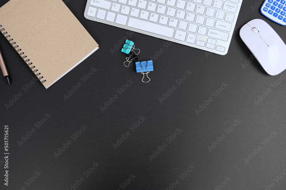Poster office desk with computer keyboard, pen, eyeglasses, and notebook top view with copy space of a cup 