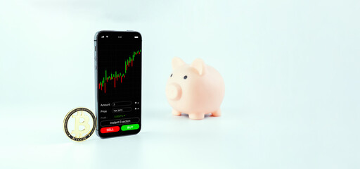 Bitcoin trading. Exchange bitcoin mobile phone app. Gold crypto currency BTC bitcoin, pink pig bank on white background. Saving money and financial concept bank.