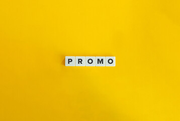 Promo Word on Letter Tiles on Yellow Background. Minimal Aesthetics.