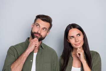 Photo of young two people curious look empty space minded dream hmm creative isolated over grey...