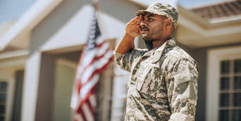Patriotic young soldier saluting outdoors - Powered by Adobe