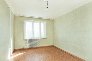 bright empty room with a window in the apartment