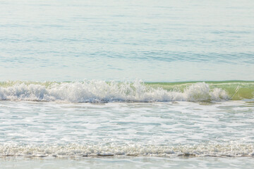 Photo of surface motion water of sea or ocean with beautiful sky blue light tone.