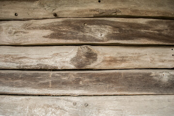 Wooden background, natural wood texture. Background of logs, old wooden log cabin with a crevice