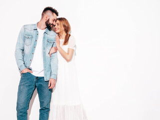 Sexy smiling beautiful woman and her handsome boyfriend. Happy cheerful family having tender moments near blue wall in studio.Pure cheerful models hugging.Embracing each other. Cheerful and happy