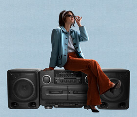 Young stylish woman dressed in 70s, 80s fashion style sitting on vintage record player on blue background. Contemporary art collage.