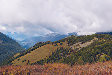Picturesque marvelous view in the mountains. Amazing mountain range valley scenic landscape among clouds and colordul hills. Autumn season in the mountains stock photography